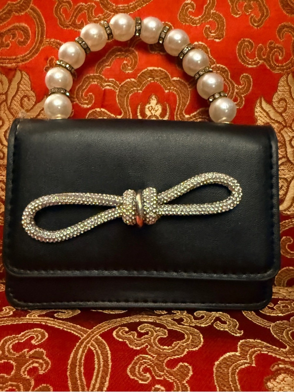Women's Black Mini Handbag with Pearl Handle and Crystal Knot Accent